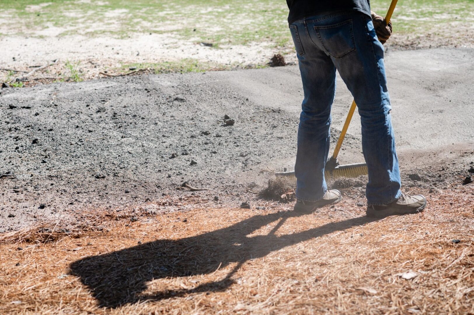 man cleaning the ground
